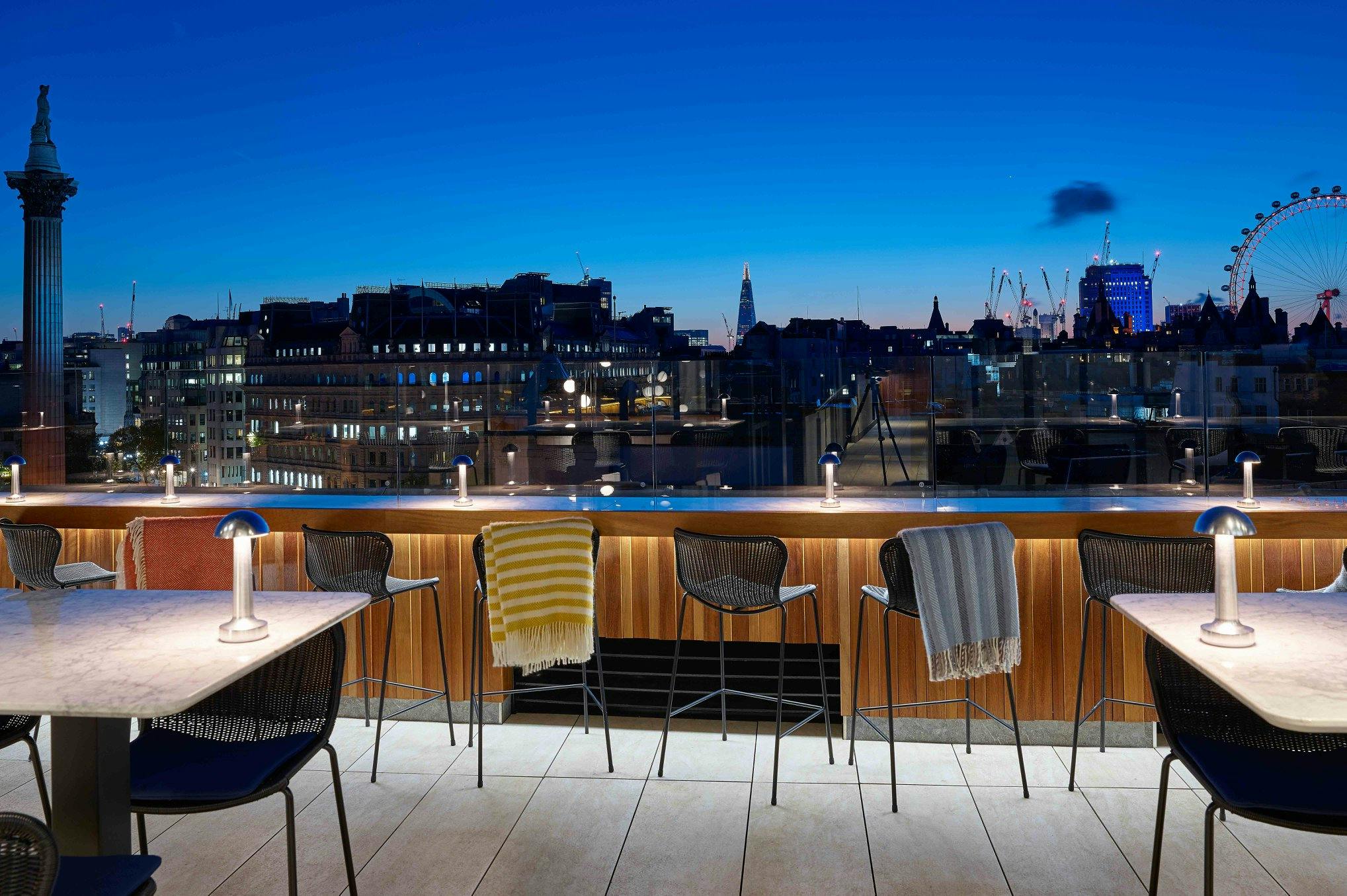 Rooftop venue at Trafalgar St James with city skyline, perfect for upscale events.