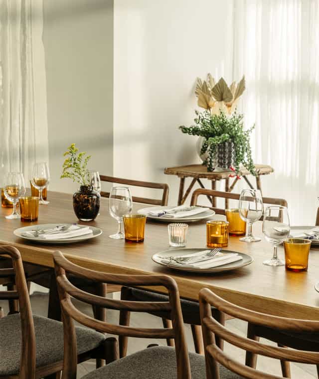 Elegant dining table with amber glassware at The Hoxton Southwark for corporate events.