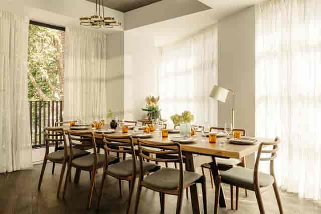 Elegant meeting space with wooden table, ideal for networking events and gatherings.