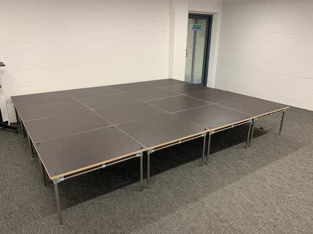Modular stage setup at Vandon Rooms, ideal for presentations and performances.