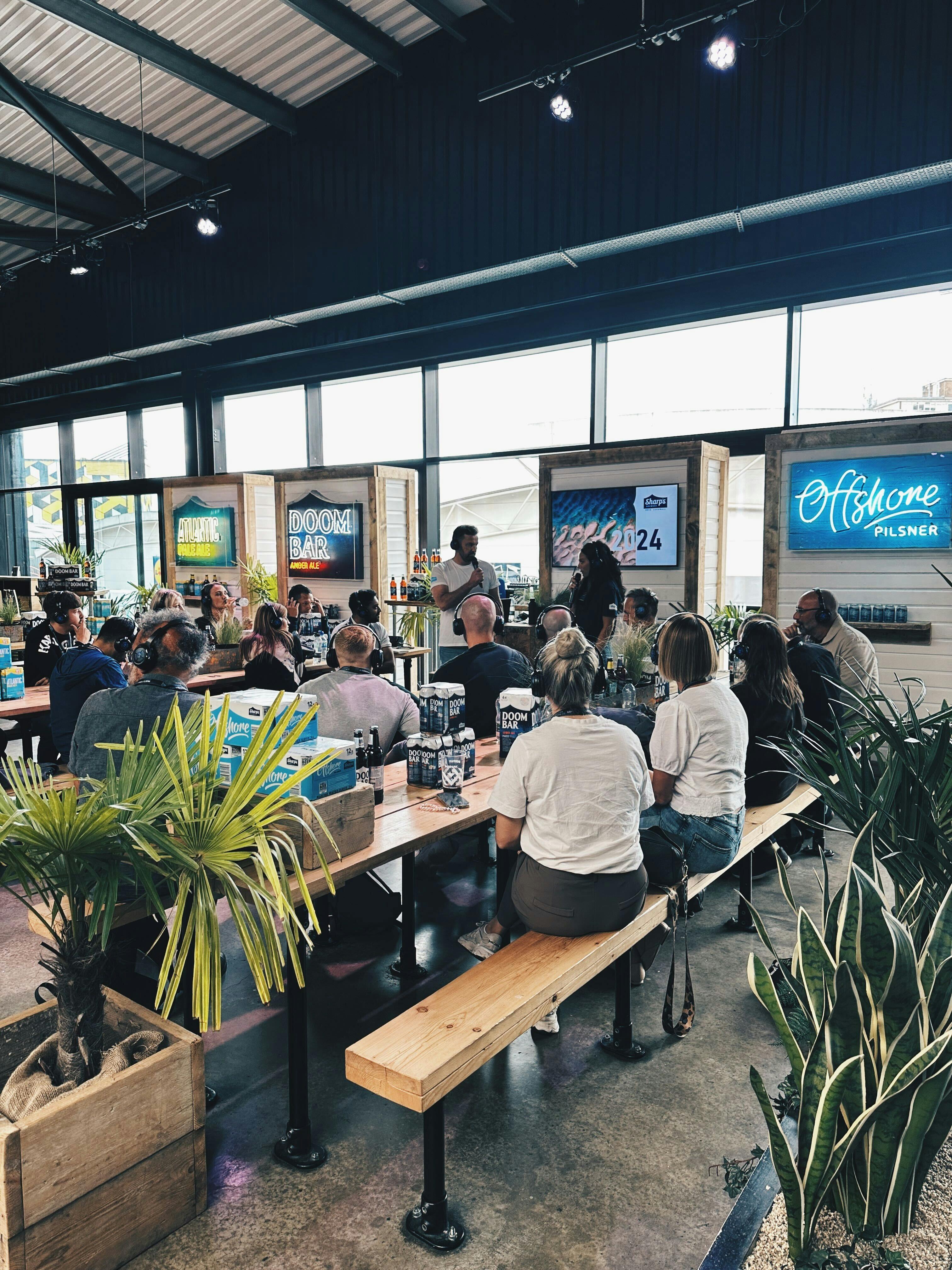 Vibrant PlayBox Bar meeting space at Boxpark Wembley for networking and presentations.