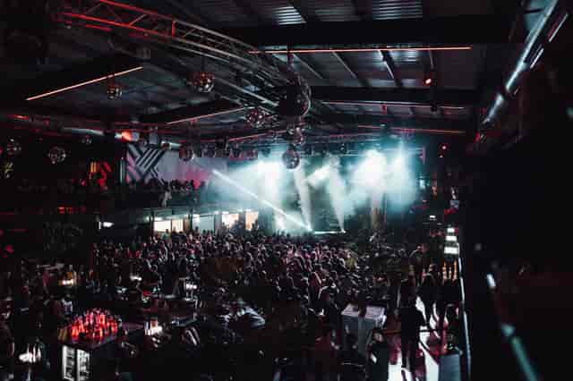 Vibrant event space at Boxpark Wembley with dynamic lighting for concerts and gatherings.