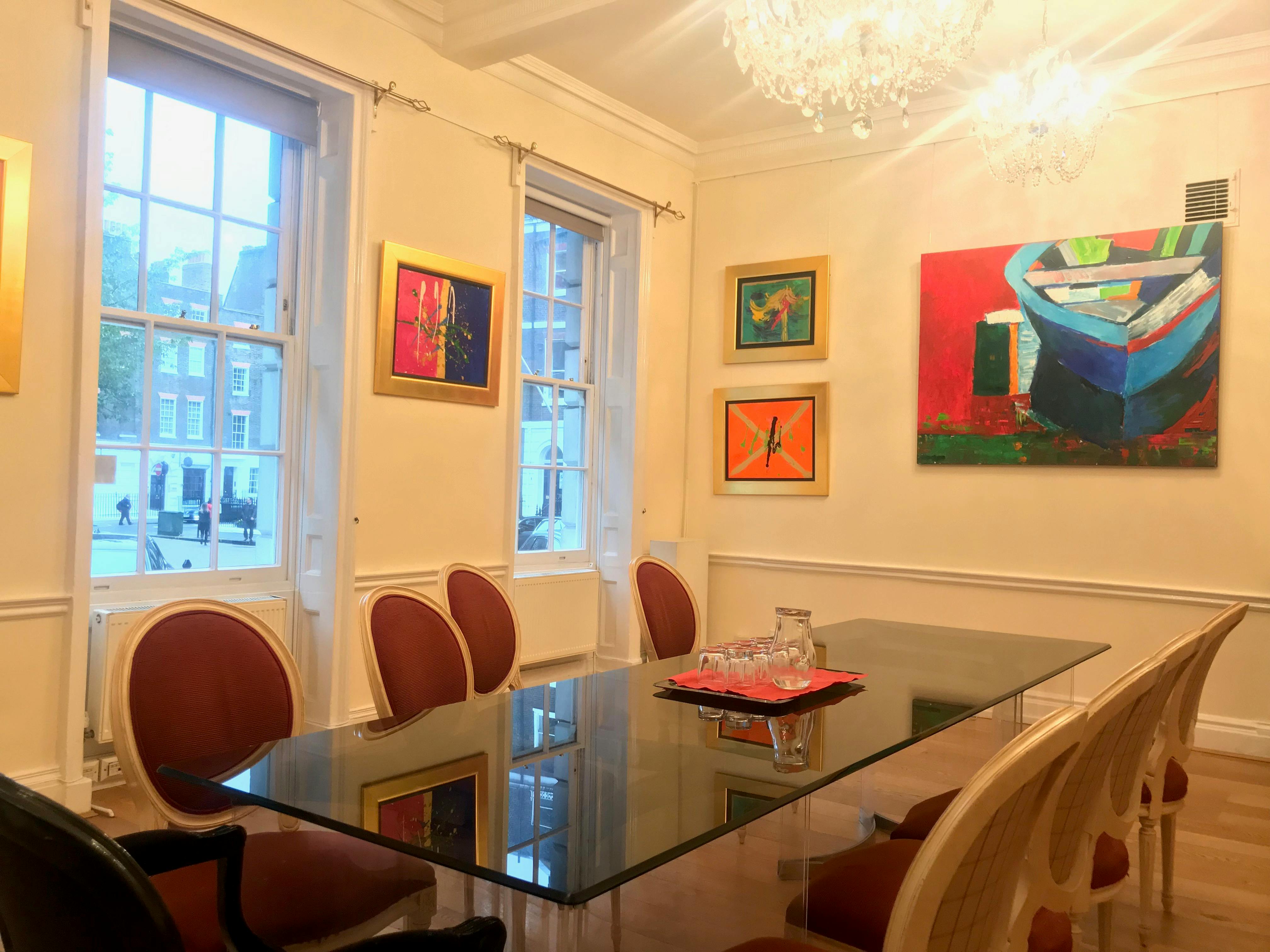 Elegant meeting room with glass table, ideal for gatherings at Ratiu Family Foundation.