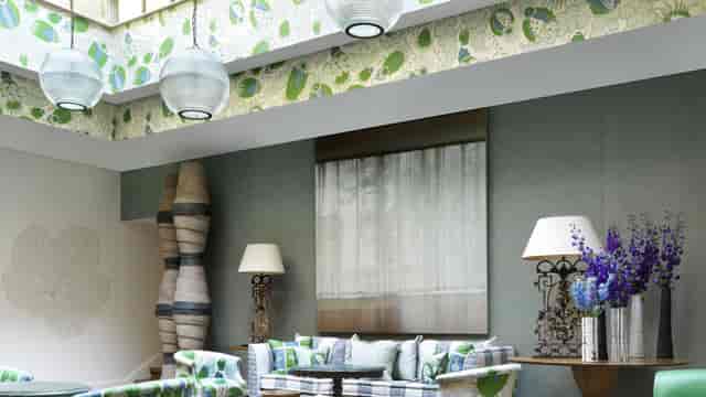 Stylish Rocklin Room at Haymarket Hotel, ideal for meetings and gatherings with vibrant decor.