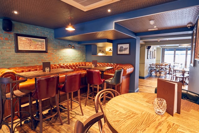 Stylish East Putney Tavern restaurant with warm lighting for networking events.