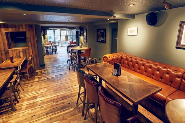 Versatile event space in East Putney Tavern with cozy seating for gatherings and meetings.