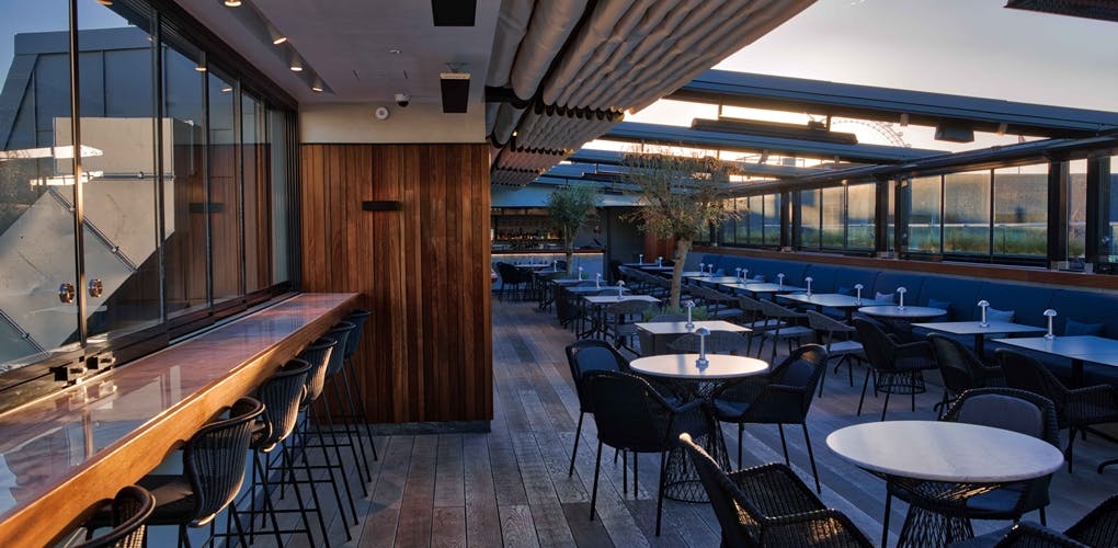 Stylish rooftop venue at Trafalgar St James for events with modern furnishings and natural light.