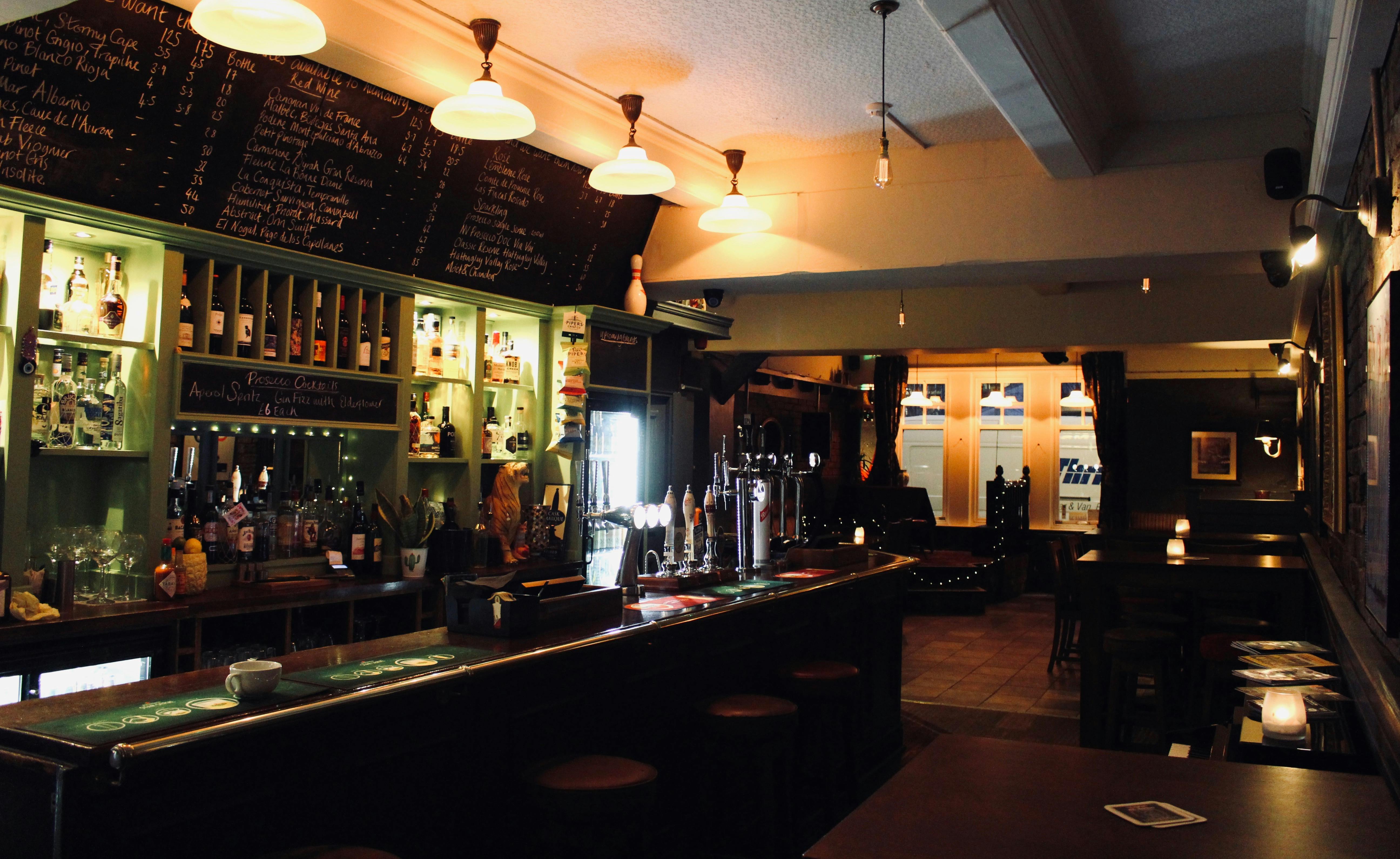 Cozy bar at The Rose and Monkey, perfect for networking events and casual meetings.