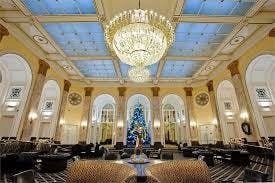 Elegant Grand Lounge at The Adelphi Hotel with chandelier, perfect for upscale events.