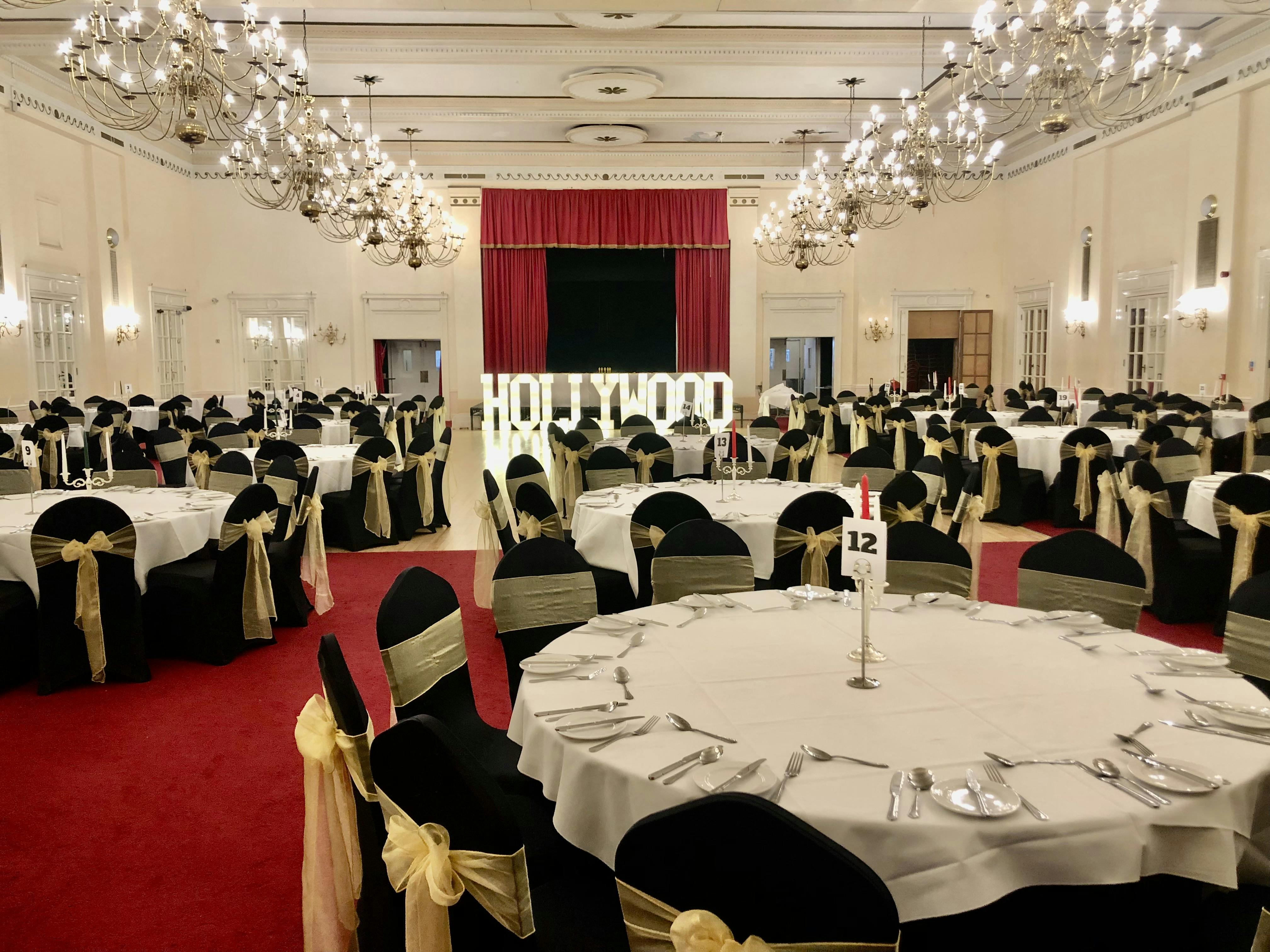 Banqueting Hall at The Adelphi Hotel, elegant black and gold decor for gala events.