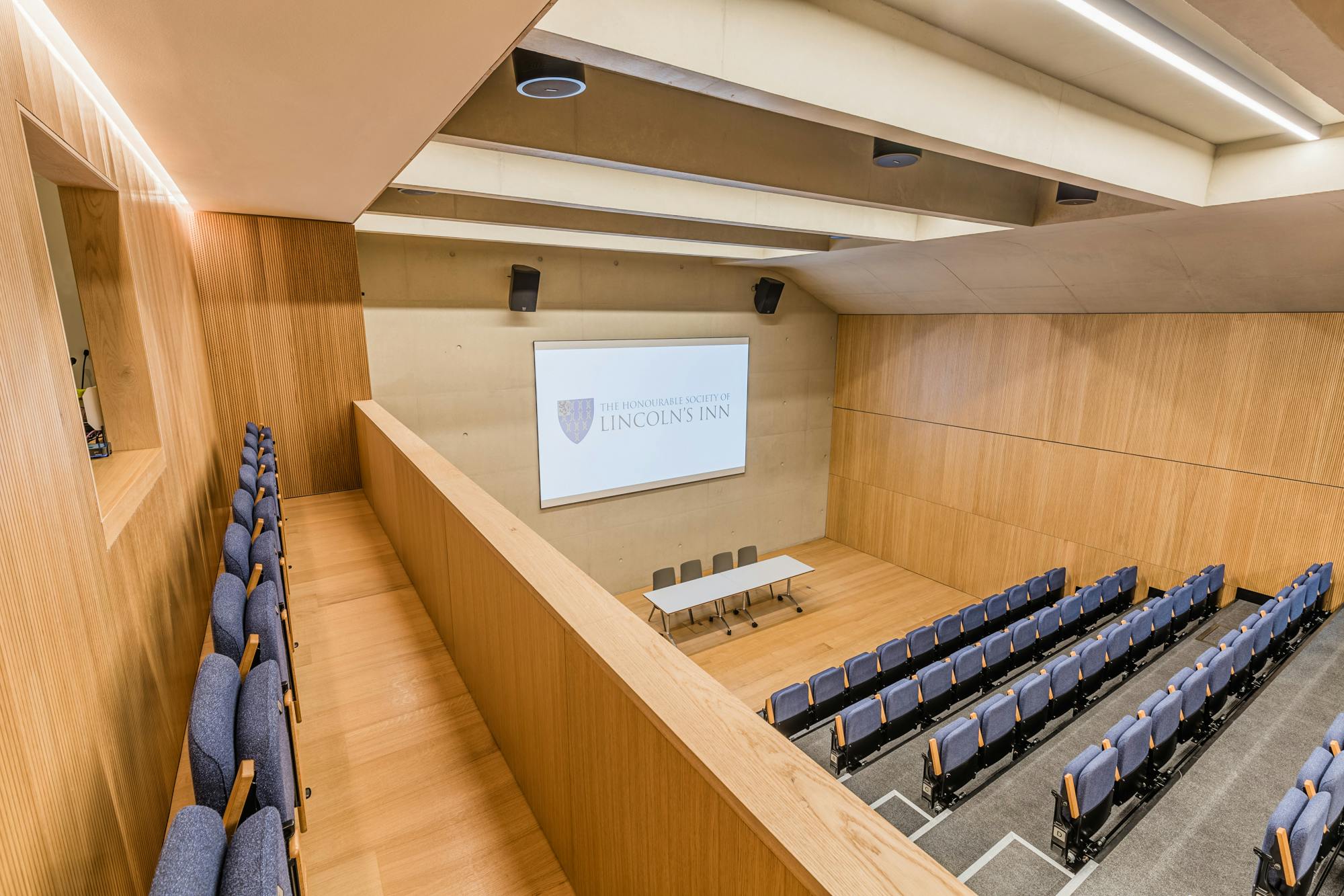 Modern auditorium with tiered seating at Ashworth Centre, ideal for events and meetings.