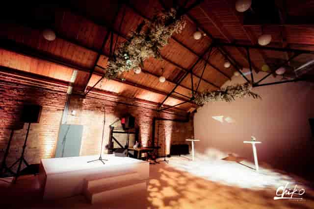Stylish Loft Studios event space with exposed brick, perfect for corporate meetings and weddings.