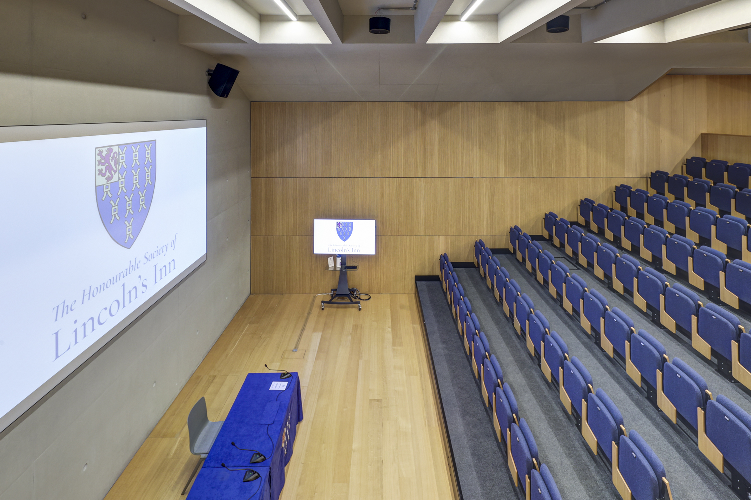 Modern conference room at Ashworth Centre with tiered seating for impactful presentations. - Banner
