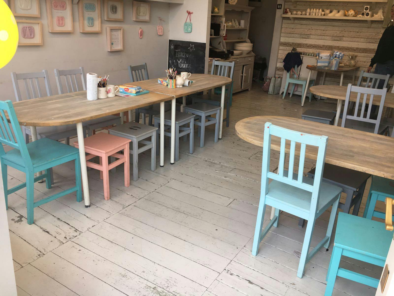 Cozy venue with pastel chairs, ideal for small meetings and workshops.