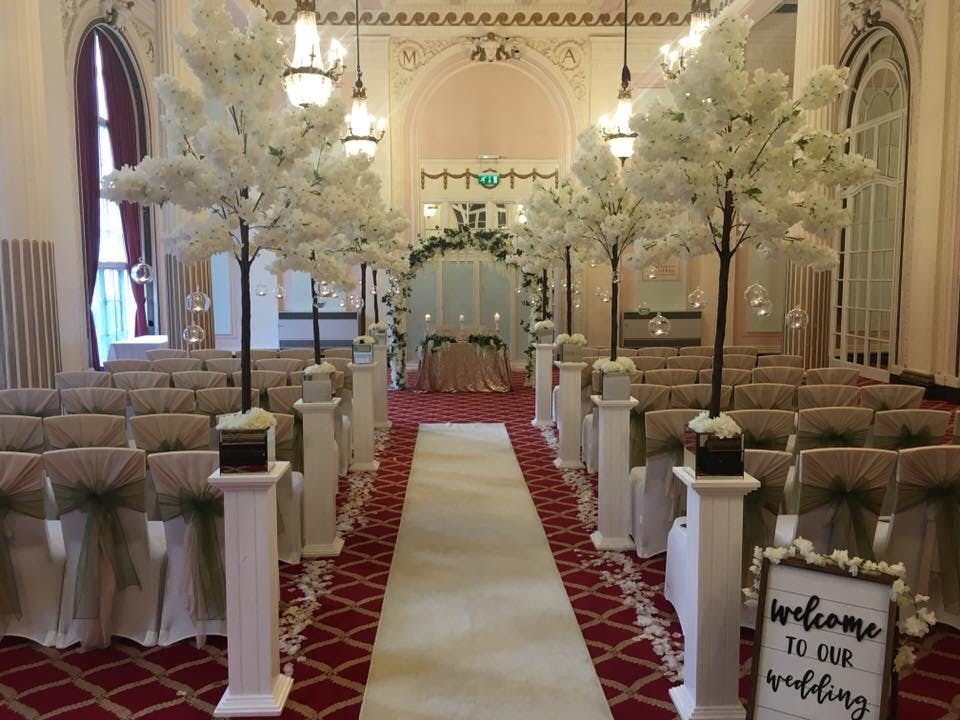 Derby Suite at The Adelphi Hotel, elegant wedding venue with white trees and floral decor.