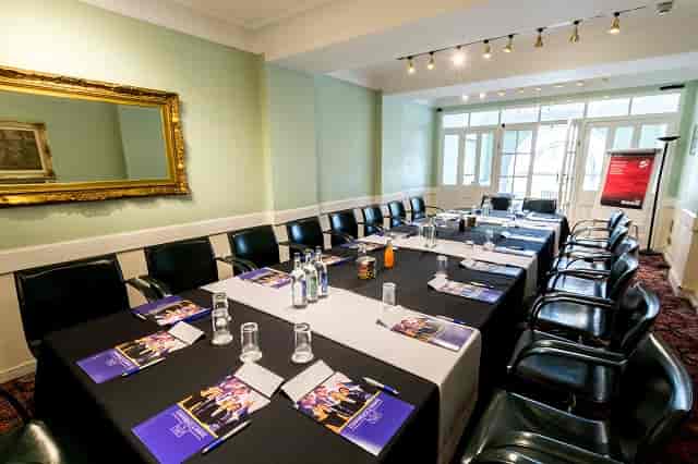 Executive Suite at The Adelphi Hotel, elegant meeting room setup for professional events.