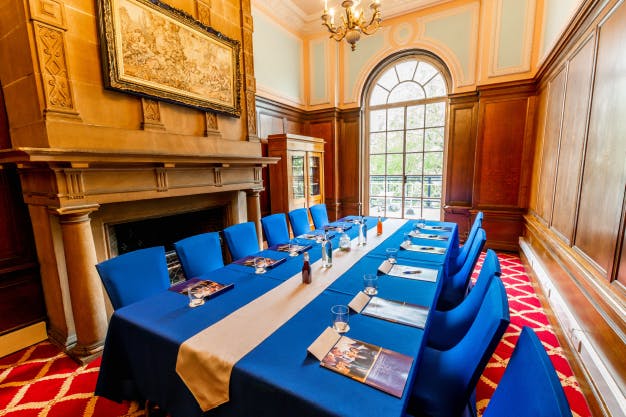 Elegant meeting room in The Adelphi Hotel with blue decor for corporate events.