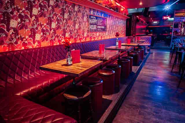 Semi-private venue with plush seating, perfect for casual gatherings and networking events.