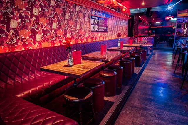 Semi-private venue with plush seating, perfect for casual gatherings and networking events.