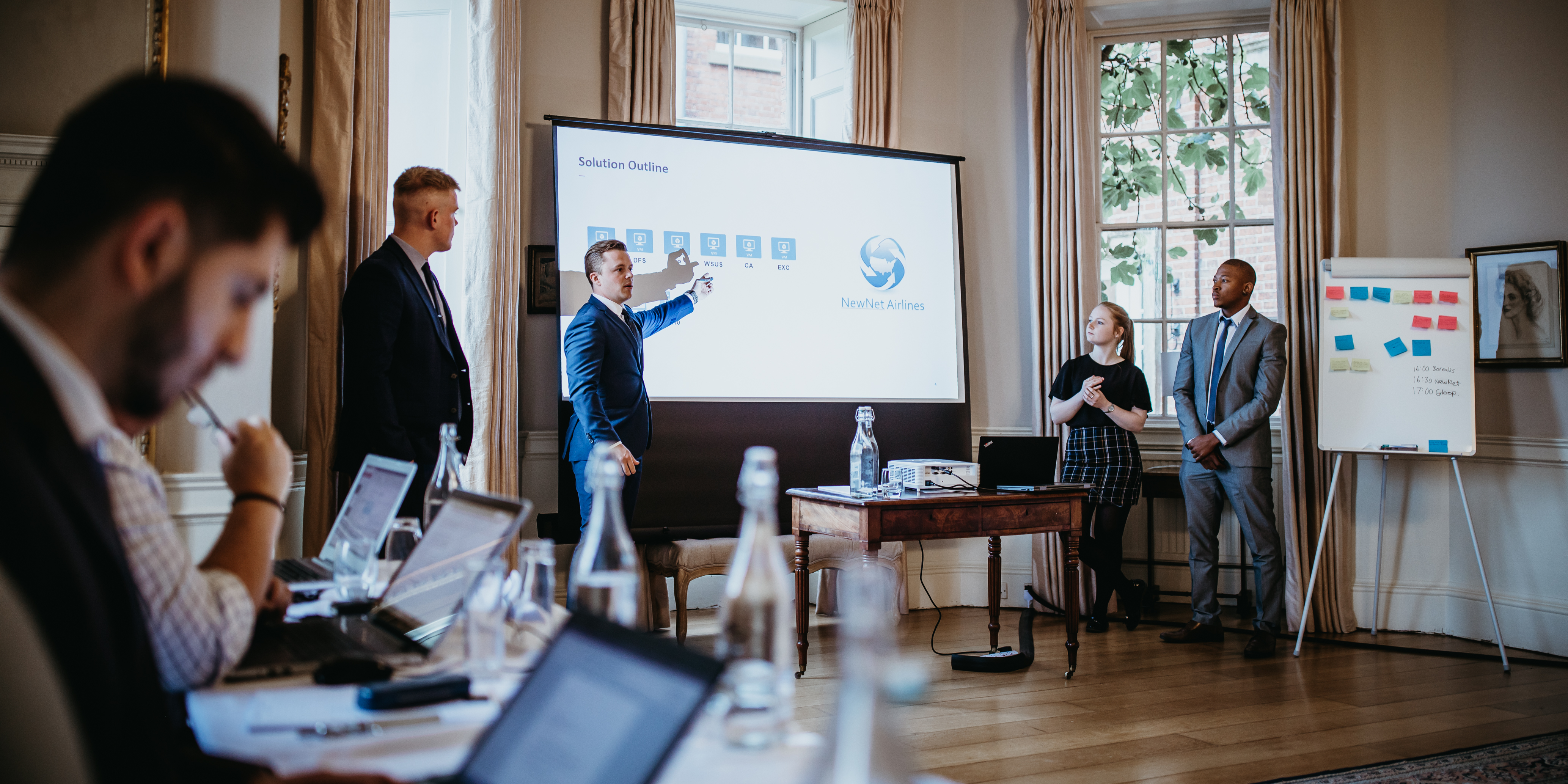 Professional meeting at Norwood Park Country House with engaged audience and visual aid.