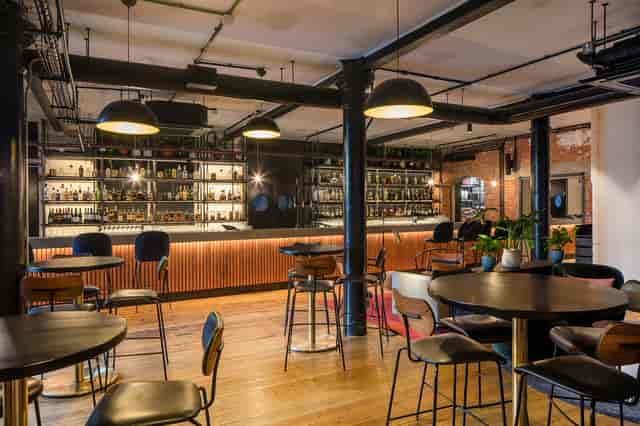 Industrial-chic bar and garden venue for corporate cocktail networking events.