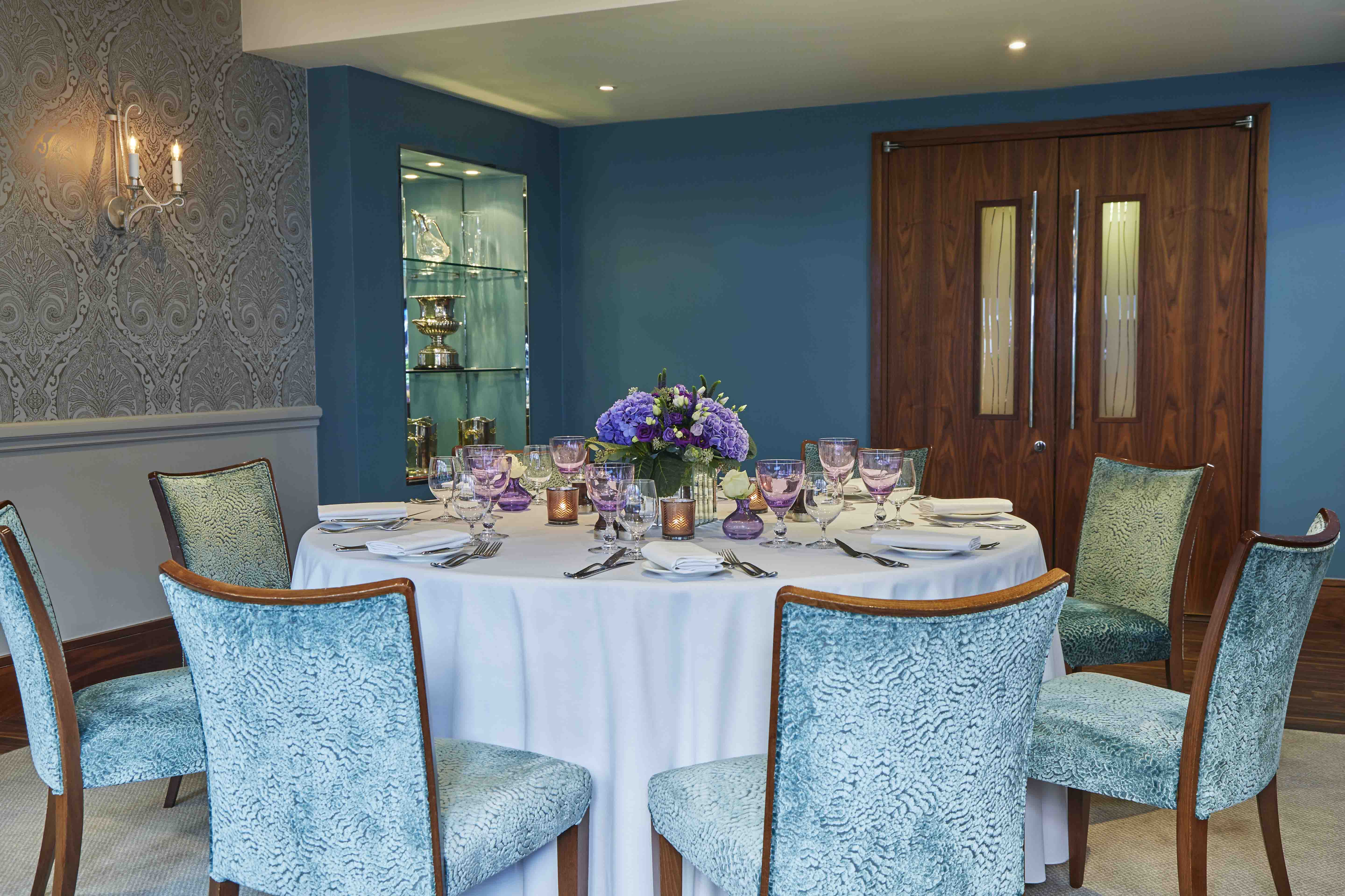 Eaton suite at The Capital Hotel: elegant round table for upscale meetings and events.