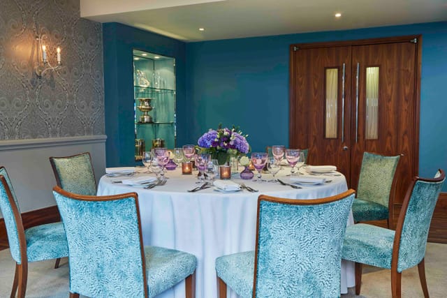 Eaton suite at The Capital Hotel: elegant round table for upscale meetings and events.