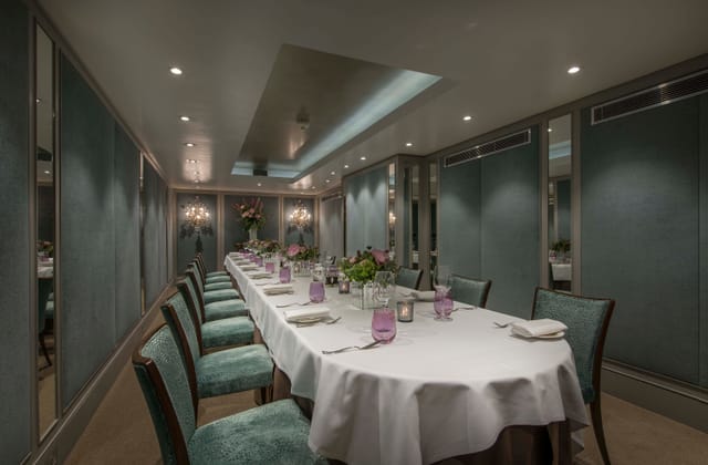 Cadogan Suite meeting space with elegant table, ideal for exclusive events and gatherings.
