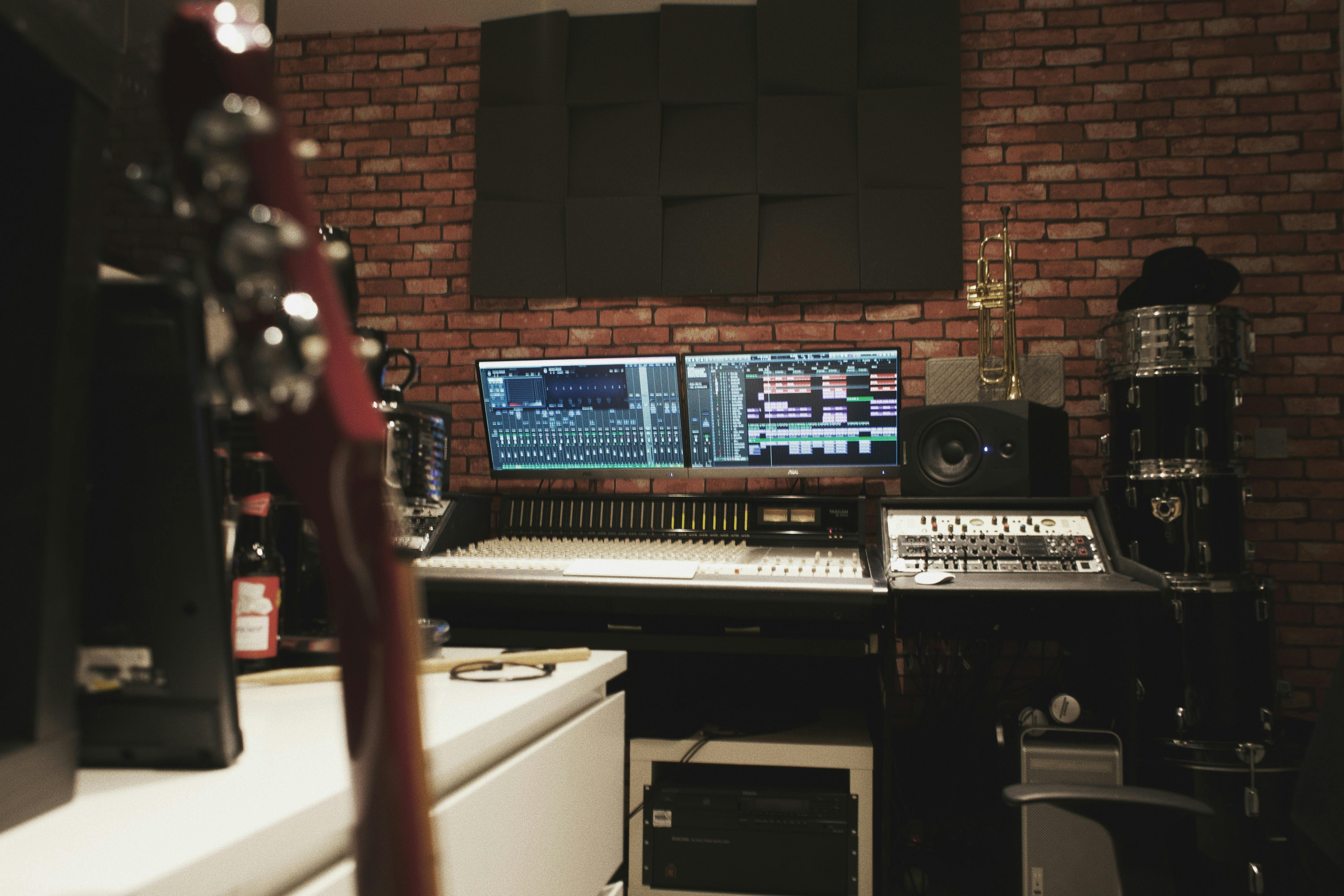 Modern recording studio with dual monitors, perfect for music production workshops.
