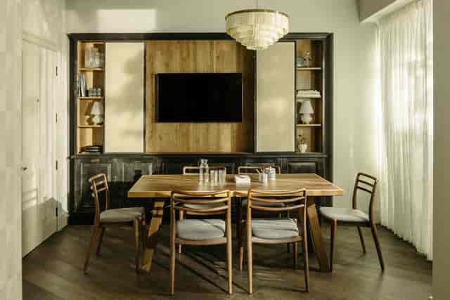 Stylish meeting room at The Hoxton Southwark with wooden table, perfect for team meetings.