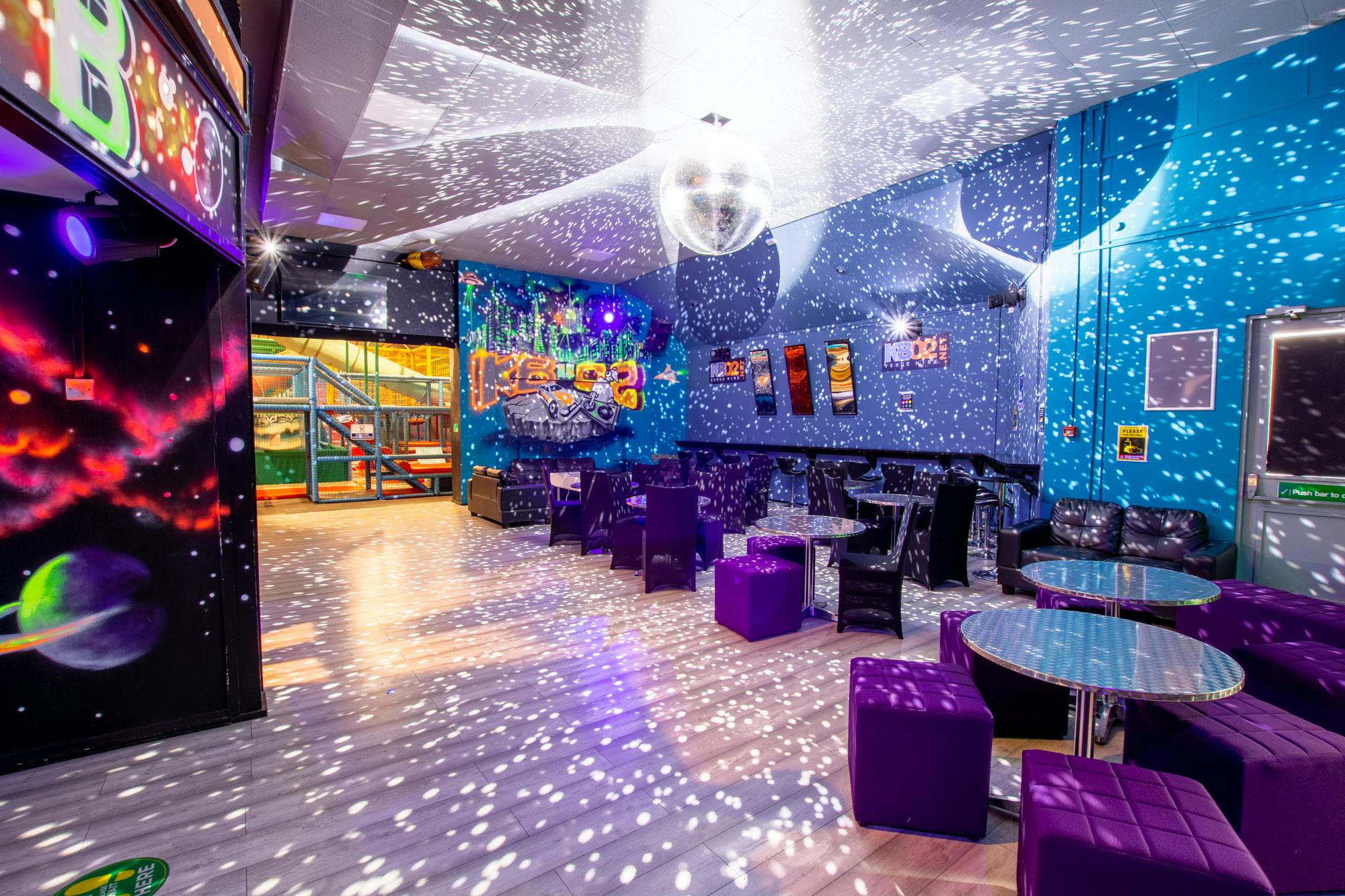 Vibrant event space with disco ball, perfect for lively parties and gatherings.