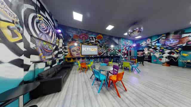 Vibrant event space with bold murals, ideal for workshops and gatherings.