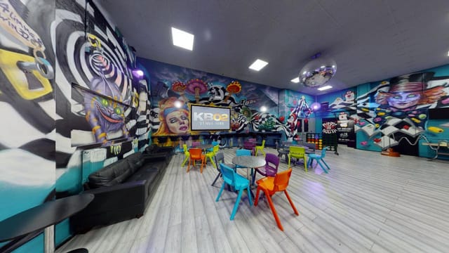 Vibrant event space with bold murals, ideal for workshops and gatherings.