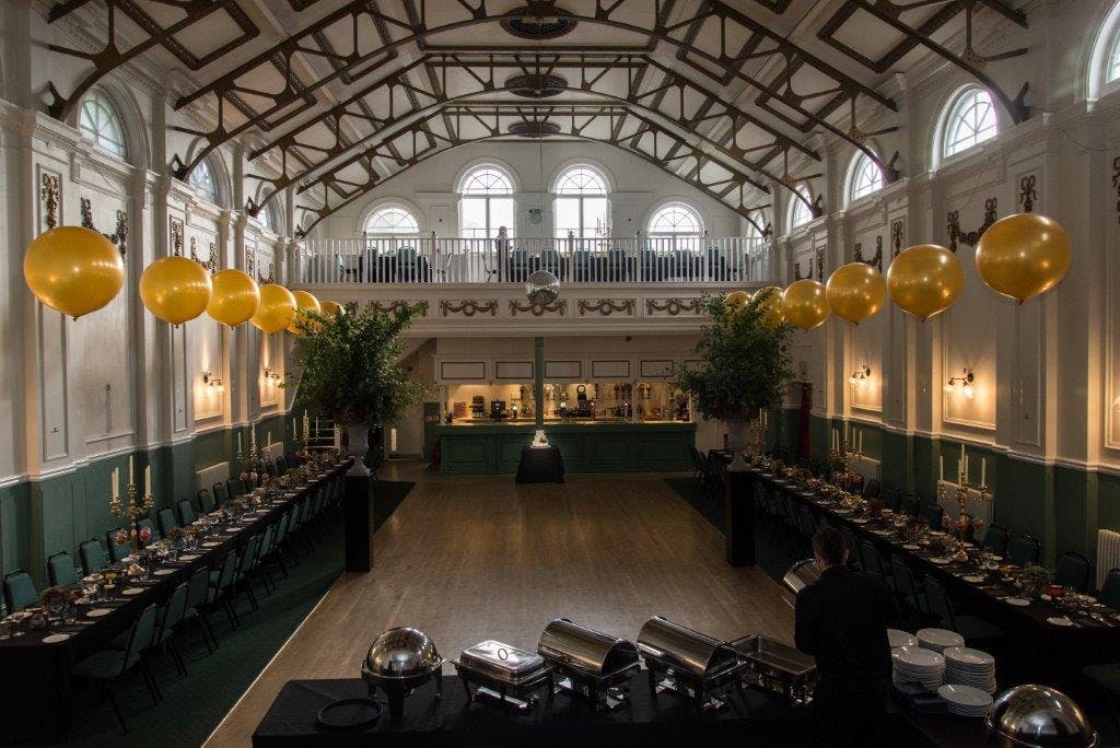 Main Hall at Hammersmith Club with high ceilings, ideal for events and dining.