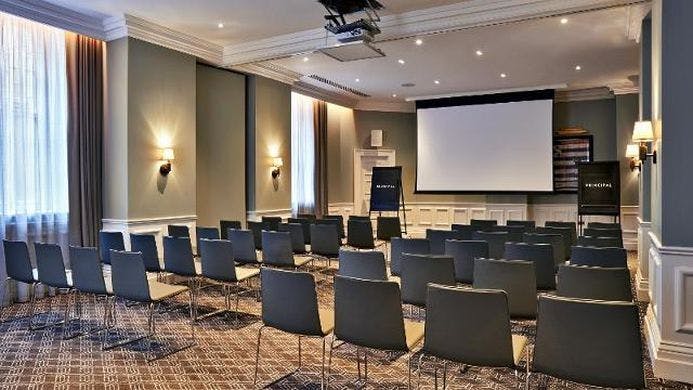 Modern meeting room at Kimpton Fitzroy London, ideal for corporate events and presentations.