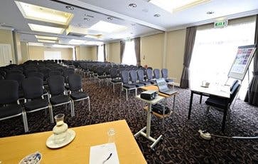 Charter Suite meeting room with projector, ideal for conferences and events.