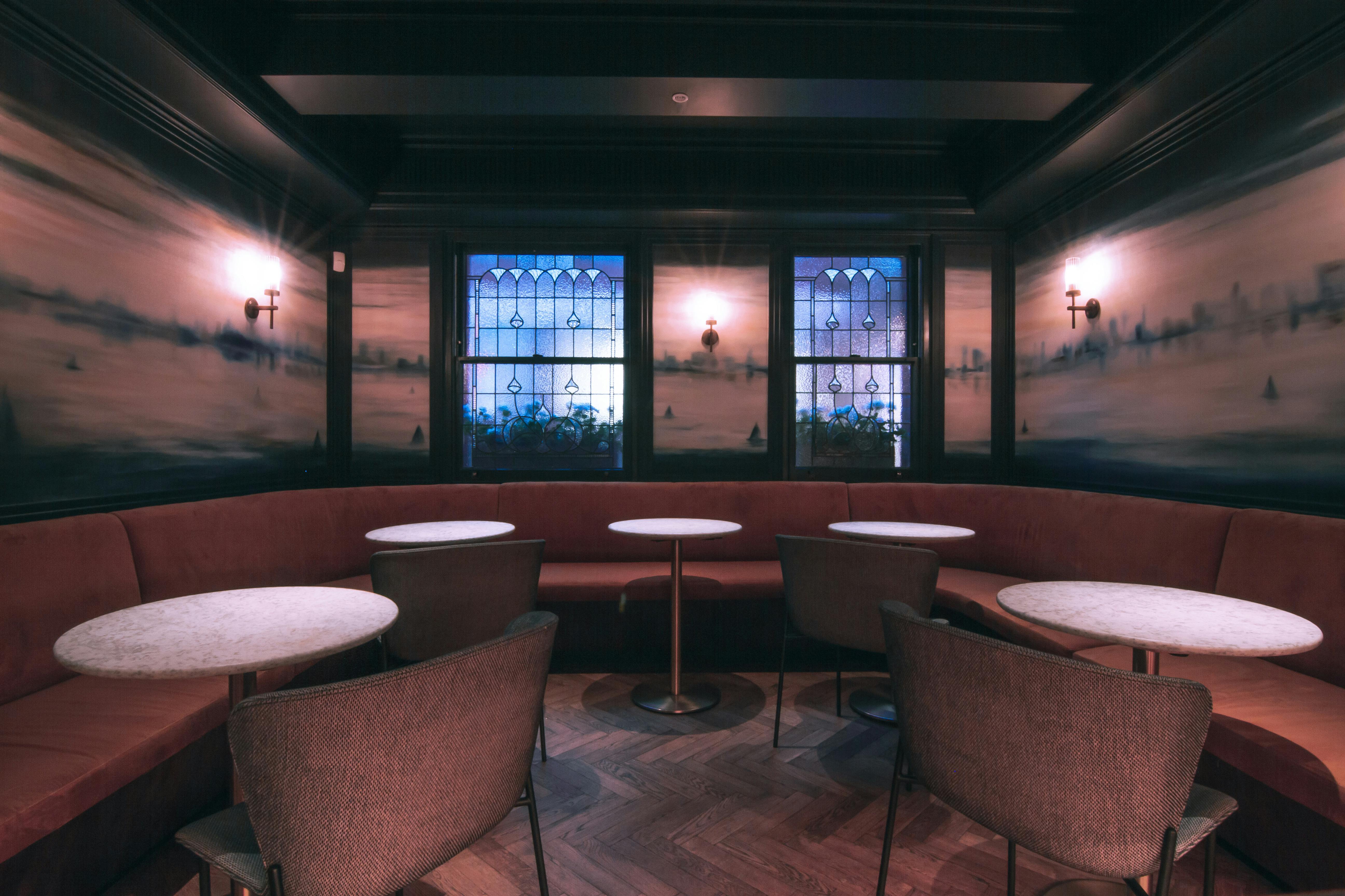Stylish meeting space 'Le Première' with plush seating, ideal for networking events.
