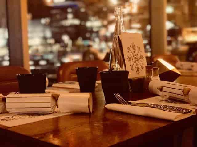 Festive corporate dinner tablescape at The Alchemist St Martins Lane for high-end event hire.