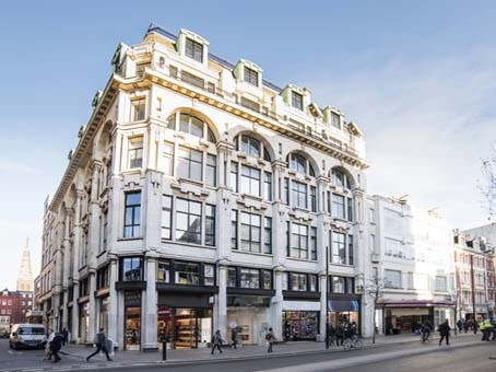 Historic event space with large windows, ideal for conferences and social gatherings.