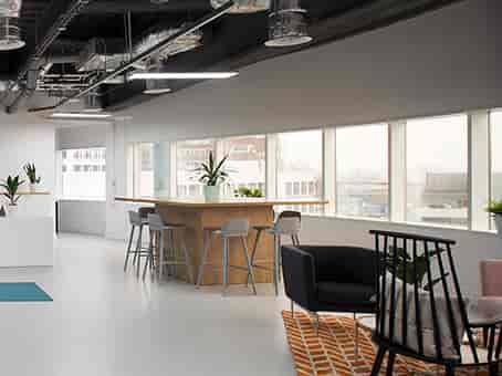 Modern meeting space with large windows for collaboration and networking events.