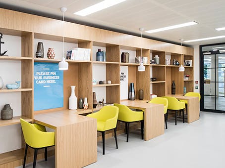 Modern workspace in Jubilee House with yellow chairs for networking events.