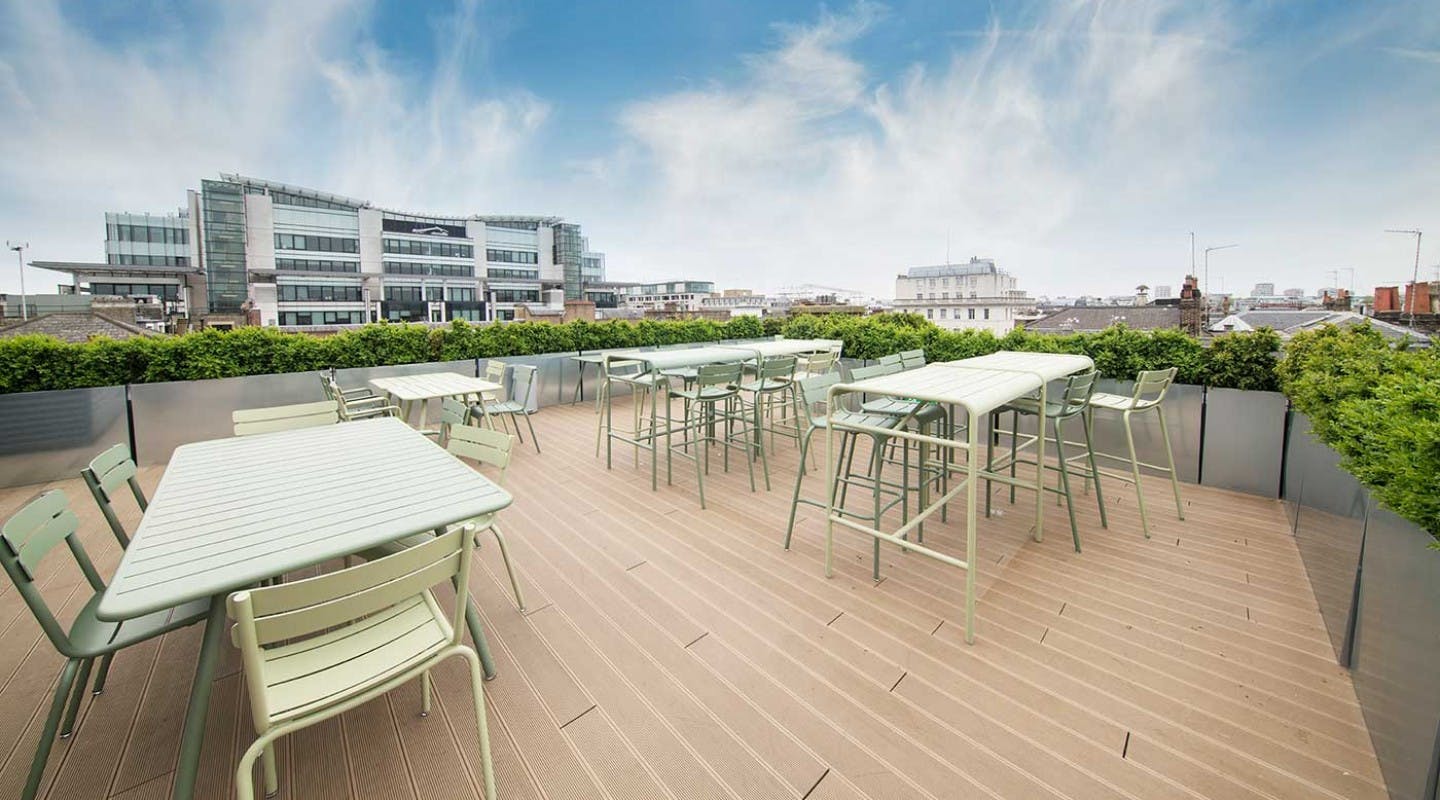 Spacious rooftop terrace with modern furniture for outdoor events in Fitzrovia.