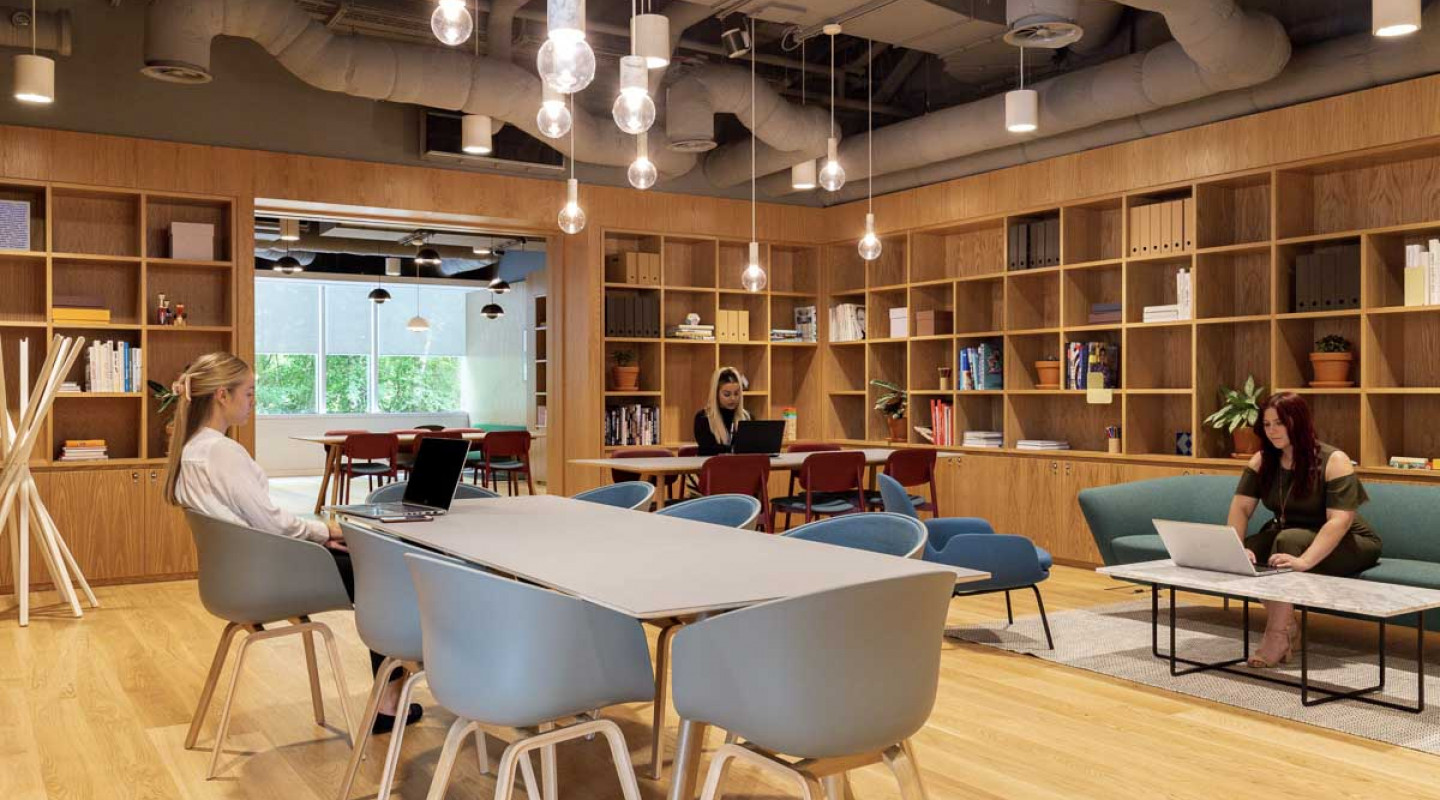 Modern meeting room at Heathrow Airport with natural light, ideal for workshops.