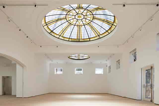 Spacious Pitzhanger Manor gallery with stained glass ceiling for events and meetings.
