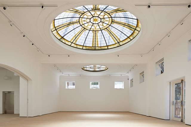 Spacious Pitzhanger Manor gallery with stained glass ceiling for events and meetings.
