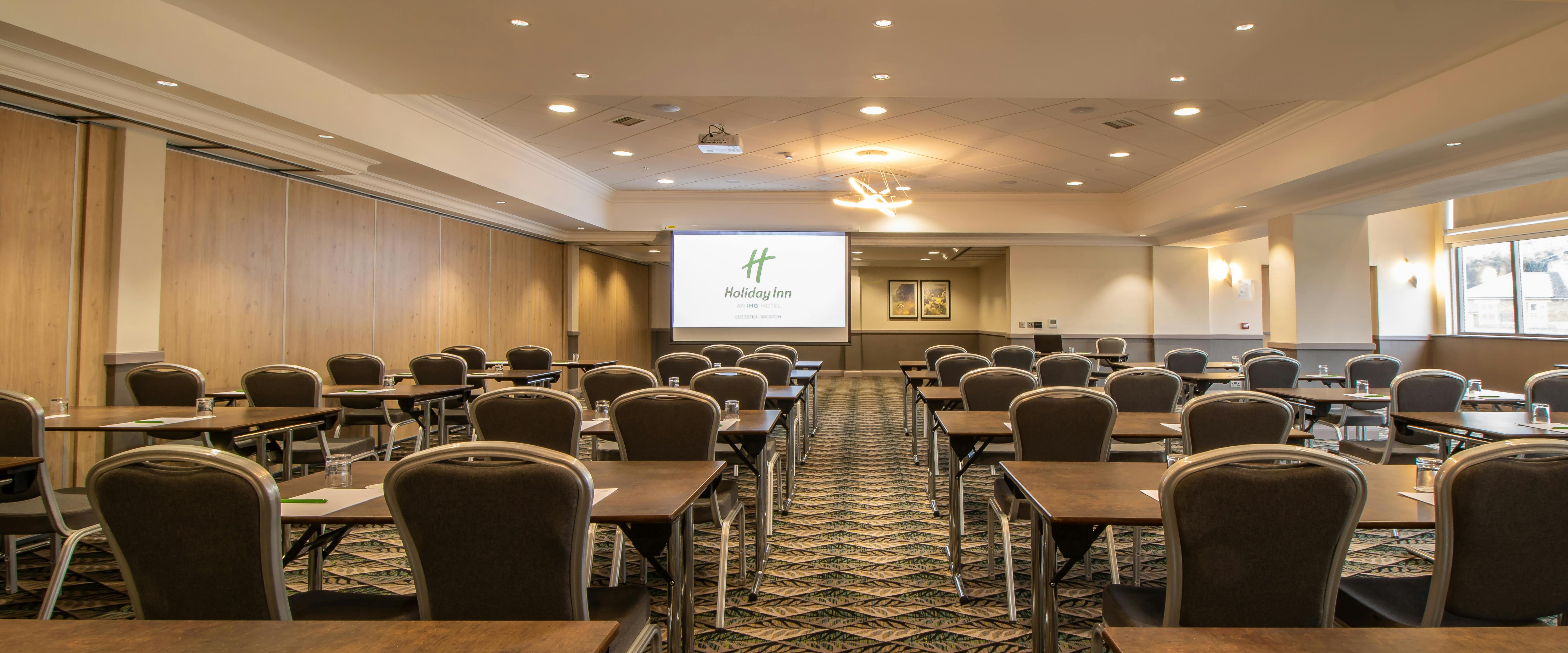 Corporate meeting room at Holiday Inn Leicester with large presentation screen.