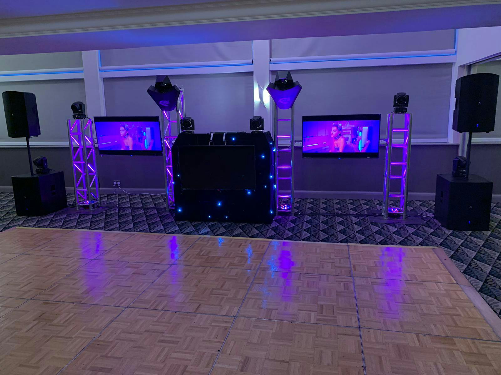 Event space at Holiday Inn Leicester Wigston with DJ setup and illuminated speakers.