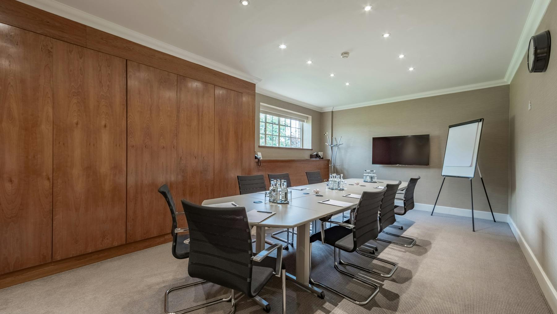 Modern meeting room at The Elvetham, Hampshire, ideal for professional gatherings and presentations.