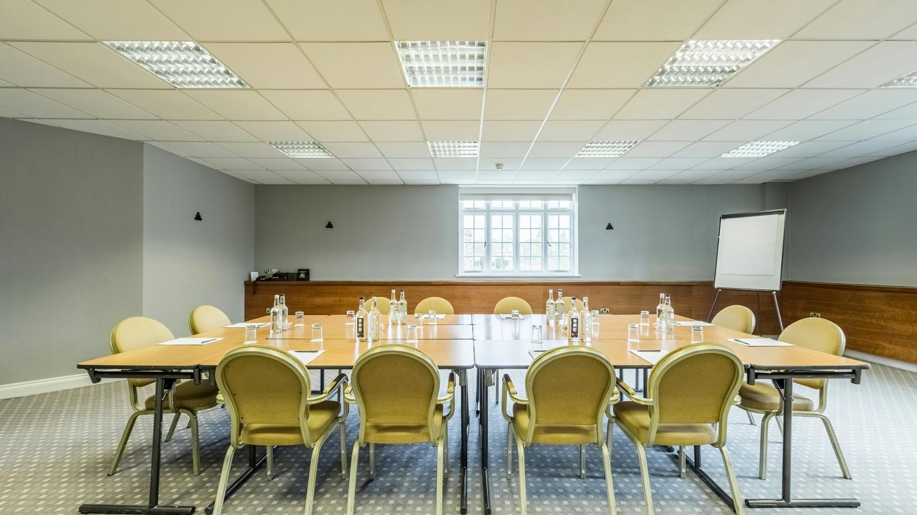 Meeting room at The Carriage, Elvetham: bright, minimalist space for corporate events.