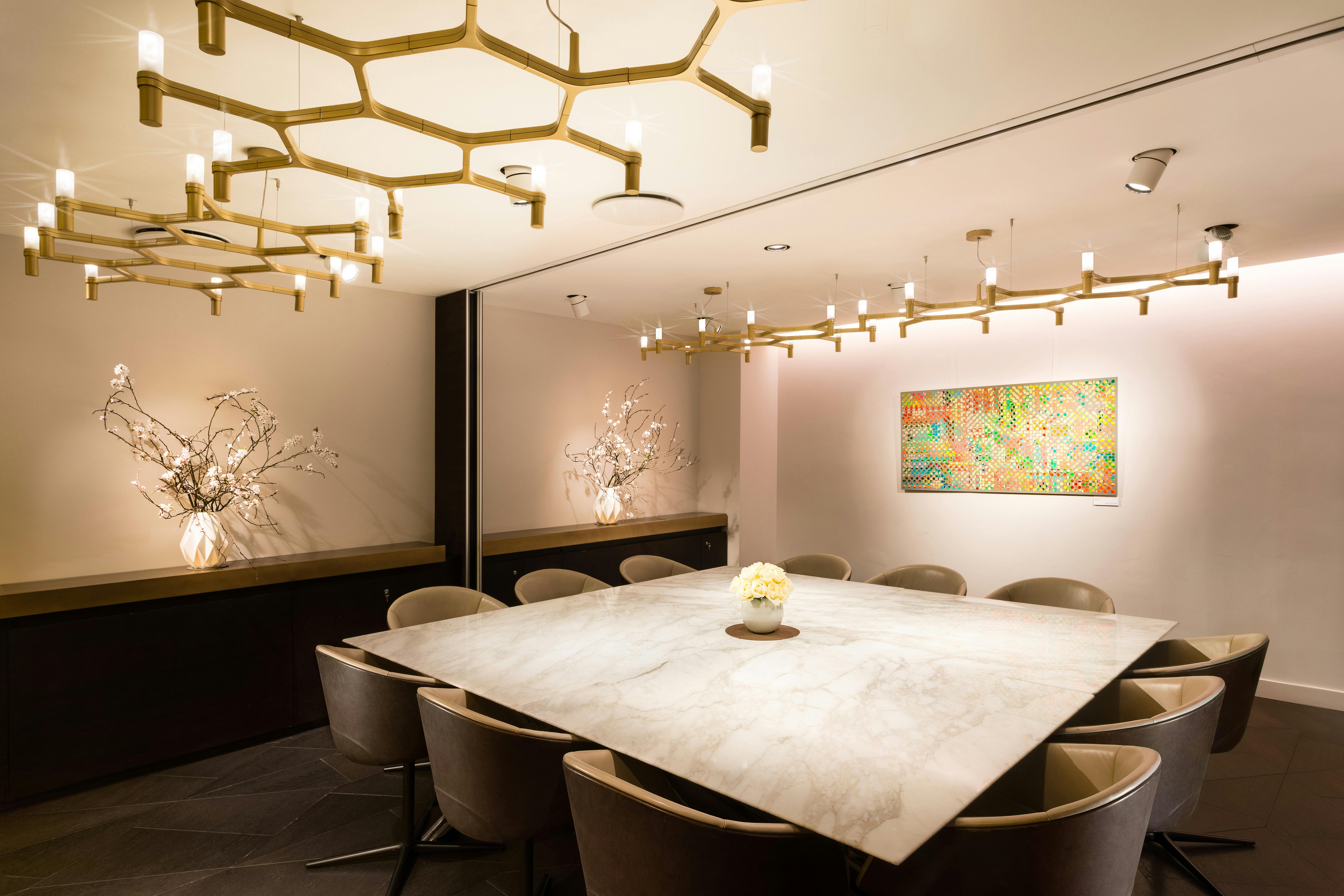 Modern meeting room at The Libraries, featuring a marble table for professional gatherings.